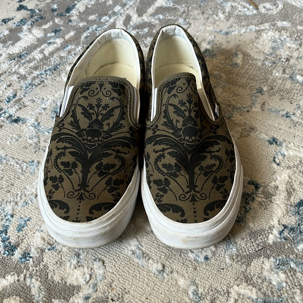Vans black and green skull slip-ons